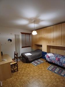 a living room with a couch and a bed at Attico 26 in Salcedo