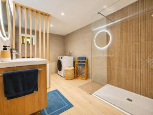 a bathroom with a shower and a sink at Voyage éco-responsable Immersion nature Wifi in Belleydoux +30 photos