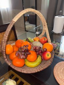 a basket of fruit sitting on a table at Chez saly in Saint-Louis +17 photos