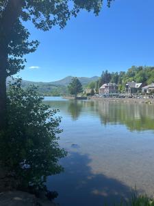 a view from the shore of a lake at Le clos des Arvernes in Corent