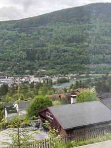 a house with a view of a river and trees at Otta Studio apartment in Sel