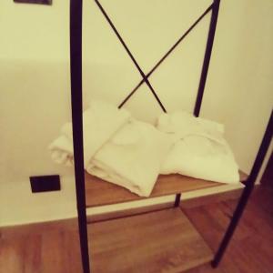 a pile of towels on a shelf in a room at Romantic Spa del Lago in Viverone