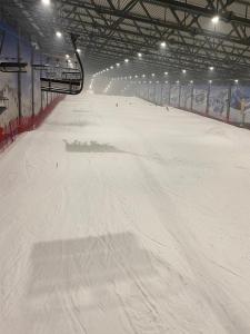 an indoor ski slope with snow on the ground at Domek Adam in Macharce