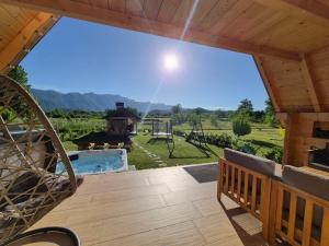 a view from the deck of a house with a playground at Planinska kuća za odmor Aneva in Sveti Rok