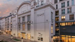 a white building on the side of a street at Ruby Sofie Hotel Vienna by IHG in Vienna