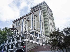a tall white building with a lot of windows at ibis Kyiv City Center in Kyiv