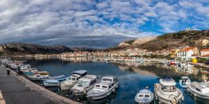 a bunch of boats are docked in a harbor at Mandy Apartman in Baška