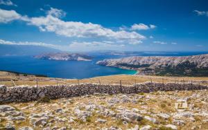 a view of crater lake from the top of a hill at Mandy Apartman in Baška