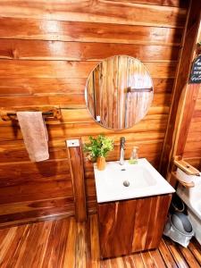 a bathroom with a sink and a mirror at Eco hotel oasis del mar in Cartagena de Indias +33 photos