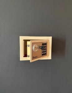 a wall outlet with a remote control on a wall at Apartments Adriatik in Ulcinj