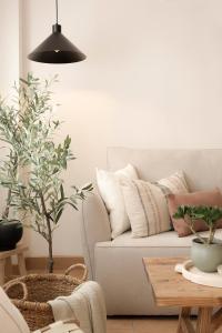 a living room with a couch and a table at CASA CALMA Isla Tabarca - Alicante in Tabarca