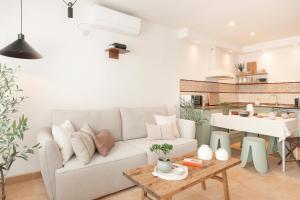 a living room with a couch and a table at CASA CALMA Isla Tabarca - Alicante in Tabarca +51 photos