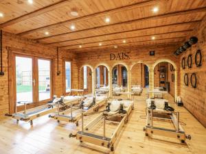 a gym with a bunch of chairs in a room at Badger's Burrow in Oakham