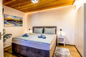 a bedroom with a large bed in a room at Casa Oliva Kim Marie /w Garden - Happy Rentals in Medulin +30 photos