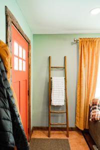 a room with a ladder next to a door at Family Fun Indoor Play Zone UP Waterfalls in Bessemer +44 photos