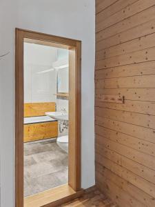 a bathroom with a toilet and a mirror at Landhaus Schönblick in Bad Kohlgrub +136 photos