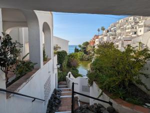 a view of a river from a balcony of a building at Casa Merlin Capistrano playa in Nerja