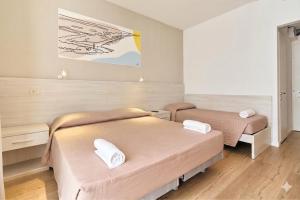 Кровать или кровати в номере Hotel Bettina +30 фотографий