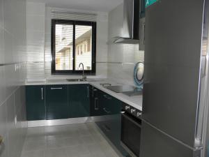Kuchyň nebo kuchyňský kout v ubytování Apartamento en Jerez de la Frontera 2