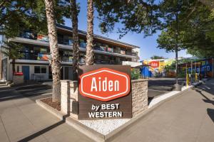 a sign for an alden by best western at Aiden Hotel Sacramento Downtown in Sacramento