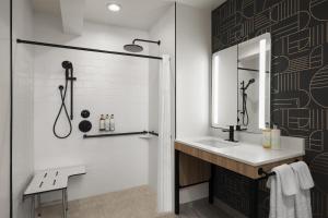 a bathroom with a sink and a mirror at Aiden Hotel Sacramento Downtown in Sacramento +38 photos