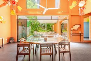 a dining room with a large table and chairs at Beautiful private villa with an ecological pool in Santa Maria Huatulco