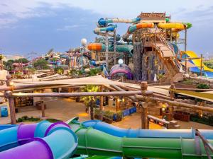 a large water park with a water slide at Adagio Abu Dhabi Al Bustan in Abu Dhabi