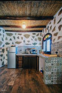 a kitchen with a sink and a refrigerator at blue moon in Chefchaouen