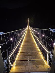 a bridge with lights on it at night at Chalet Cuarzo in Mineral del Chico +6 photos