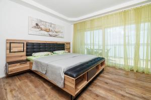 a bedroom with a bed and a large window at Apartments Maja in Selce +58 photos