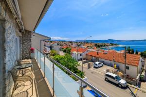 a balcony with a view of a city at Apartments Maja in Selce