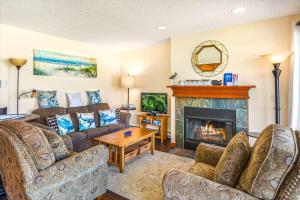 a living room with couches and a fireplace at Hi-Tide Resort Queen Bed Unit 29 in Moclips +21 photos