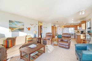 a living room with a couch and a table at Hi-Tide Resort Queen Bed Unit 12 in Moclips