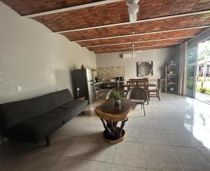 a living room with a couch and a table at Hotel El Texcalame in Lo de Marcos