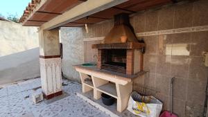 a outdoor oven in the side of a building at Finca La Senorita in Molina de Segura