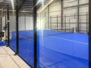 a tennis court in a building with a tennis court at 4 star holiday home in Svendborg in Svendborg