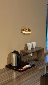 a kitchen with a coffee maker on a table at Wadi Rum Dome Camp in Disah
