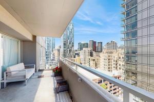 a balcony with a view of a city skyline at City Lights at Newmark - World Cup Availability in Seattle