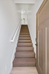a staircase leading up to a door in a building at Modern Loft Private Golf Course Retreat in Post Falls