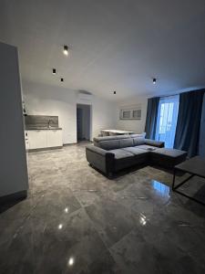 a large living room with a couch and a table at Villa Maria II in Vodice