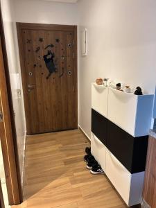 a hallway with a door and shoes in front of it at Diamond Blue in Sidi Rahal +30 photos