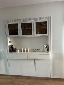 a white counter in a room with a shelf at Diamond Blue in Sidi Rahal