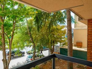 a balcony with a view of a parking lot at Boulevard Luxury Apartments City Center Ohrid in Ohrid