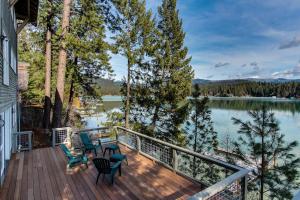 a deck with chairs and a view of a lake at Lake House Private Dock & Decks 4BR in Hayden