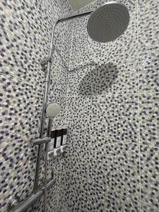 a shower with a glass door in a bathroom at La casita de Polo in Polo +25 photos