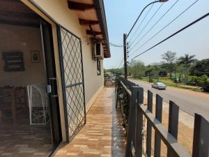 a building with a fence next to a street at Don Roque in Piribebuy
