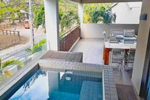 a swimming pool in the middle of a patio at Element Bay 5 in Cap Malheureux