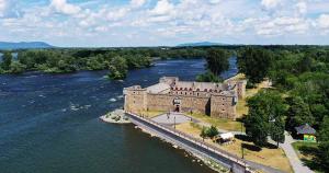 an aerial view of a castle in the middle of a river at Respite room in Chambly