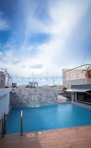 a swimming pool on top of a building at Hotel Europa in Iquitos