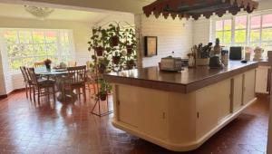a kitchen with a counter and a dining room at Habitacion en residencia compartida in Mexico City